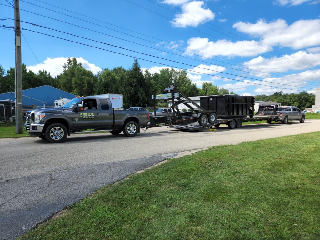 dumpster being deliver to a customer